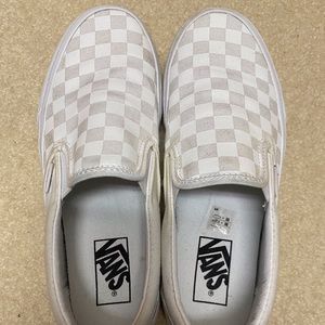White checkered slip on Vans.